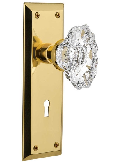 New York Door Set with Keyhole and Chateau Crystal Glass Knobs in Un-Lacquered Brass.